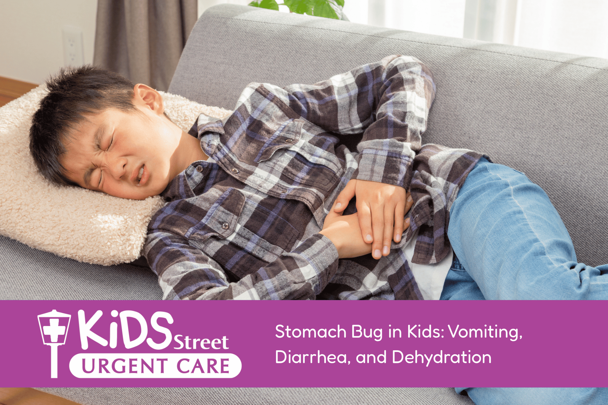 Little boy lying on the couch holding his stomach. Featured image for Stomach Bug in Kids: Vomiting, Diarrhea, and Dehydration blog post.