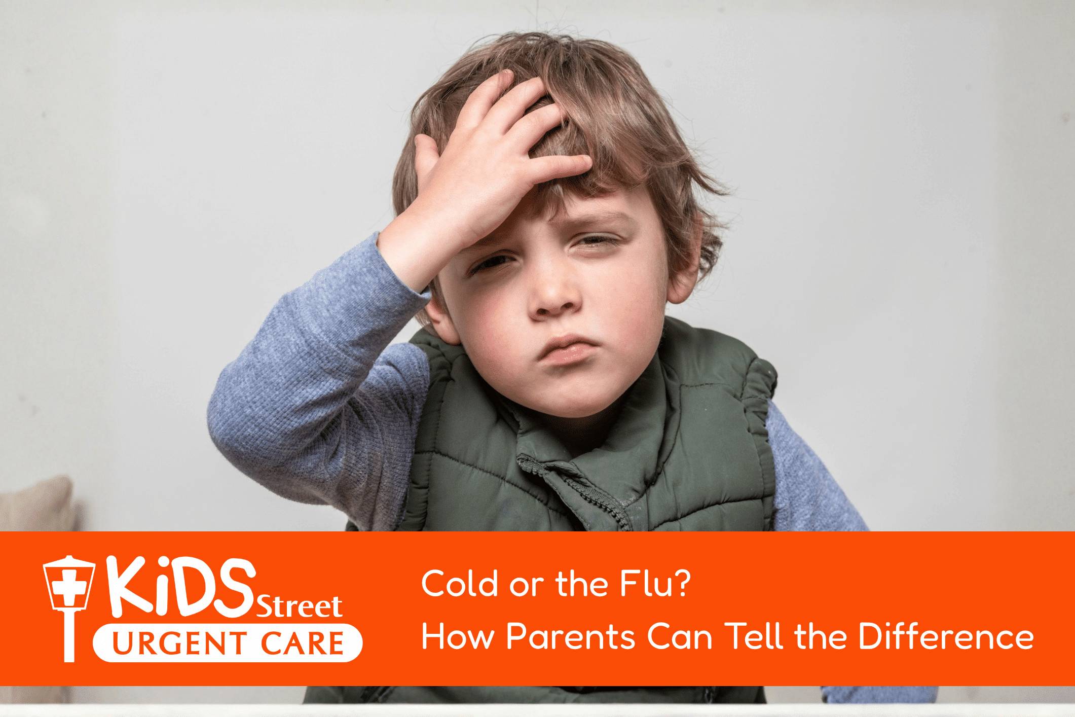 Little boy holding his head. Featured image for Cold or the Flu? How Parents Can Tell the Difference blog post.